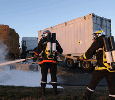 Fire brigade in action during a radioactive material transport accident exercise © AREVA/JM. Taillat